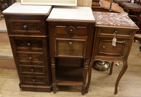 Three French walnut bedside cabinets, all with marble inset tops